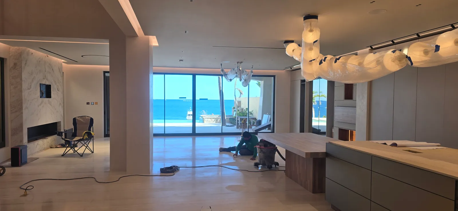Kitchen with ocean view and linear lighting