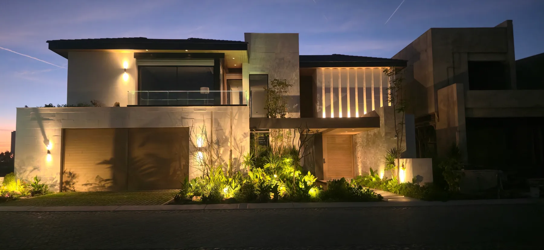 Residential façade lit at night